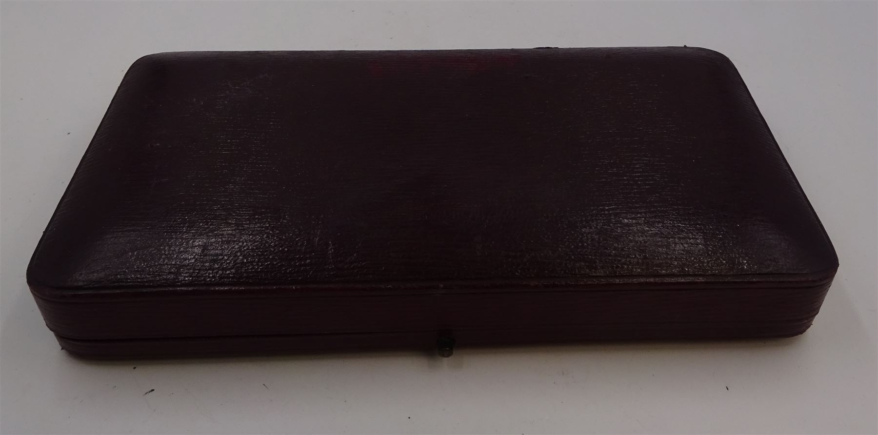 Pair of Victorian silver bon bon dishes, each of circular form, with shaped rim and repousse scroll decoration, hallmarked Fenton Brothers Ltd, Sheffield 1897, in tooled leather velvet and silk lined fitted case