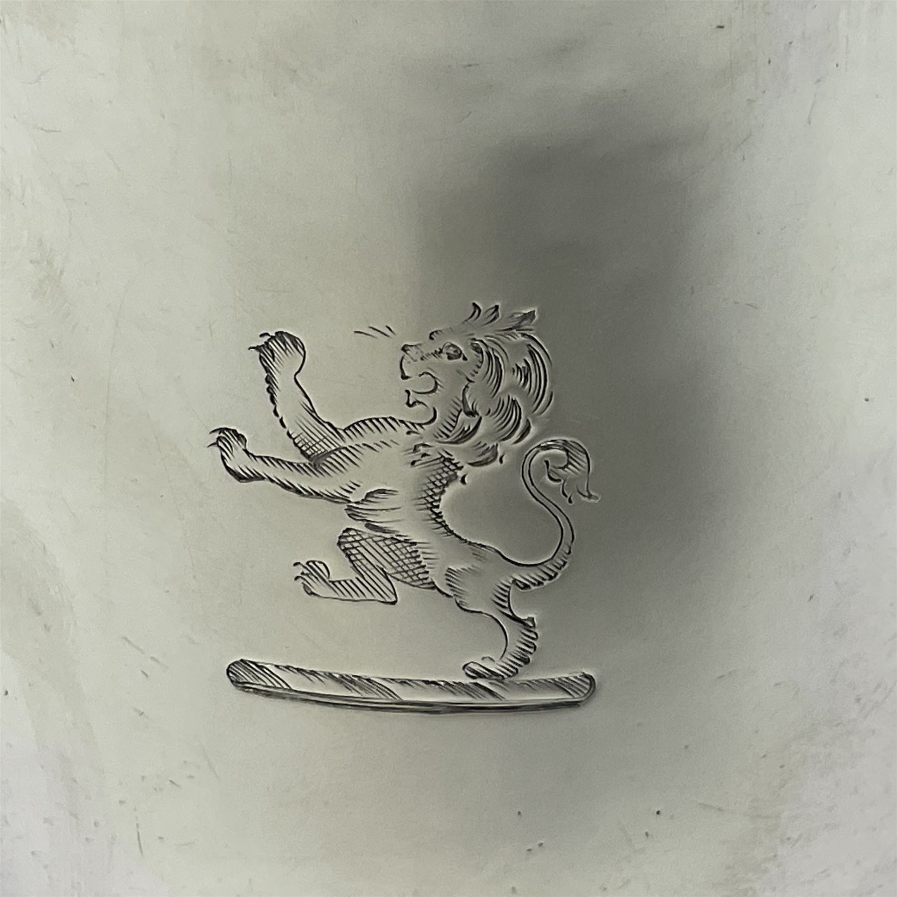 George II silver tankard, of waisted baluster form with acanthus capped C scroll handle, the body engraved with a lion rampant, upon a circular spreading foot, hallmarked Gabriel Sleath & Francis Crump, London 1754, H13cm