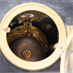 French- late 19th century 8-day mantle clock in an imposing Belgium slate case with gilt metal ornamentation. Stepped rectangular case with an angled top and square plinth surmounted by an oval shaped gilt urn with scroll handles, case with continuous strapwork and oval medallions displaying portraits from classical antiquity, raised on a gilt metal base with splayed feet, conforming unenclosed slate dial with gold incised Roman numerals and brass Fleur de Lis hands, Parisian twin train rack striking movement with pendulum regulation, striking the hours and half hours on a bell. With pendulum.