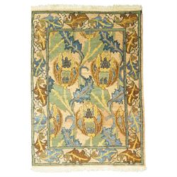 Arts & Crafts design Himalayan wool pile rug, decorated with repeating stylized floral see...