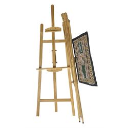 Boldmere wooden artists easel, together with a similar wooden easel by Artistik and Aboriginal artwork on fabric, tallest easel H143cm