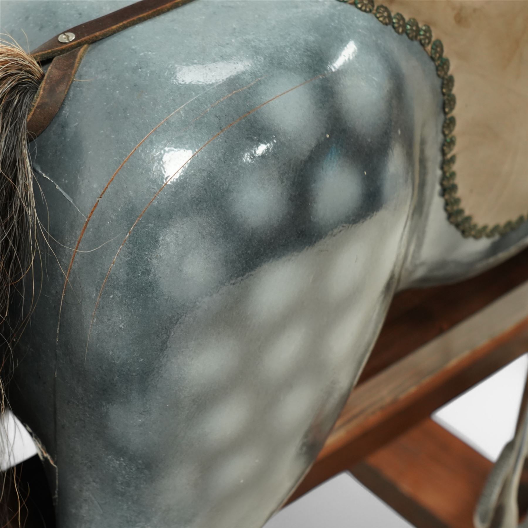 Wooden rocking horse, in Dapple Grey paint finish with reins and stirrups, on pine trestle base, metal plaque inscribed 'Hoppringle Horses by J. J.V. Eyre Hoppringle by Stow, Galashiels TD1 2TJ'