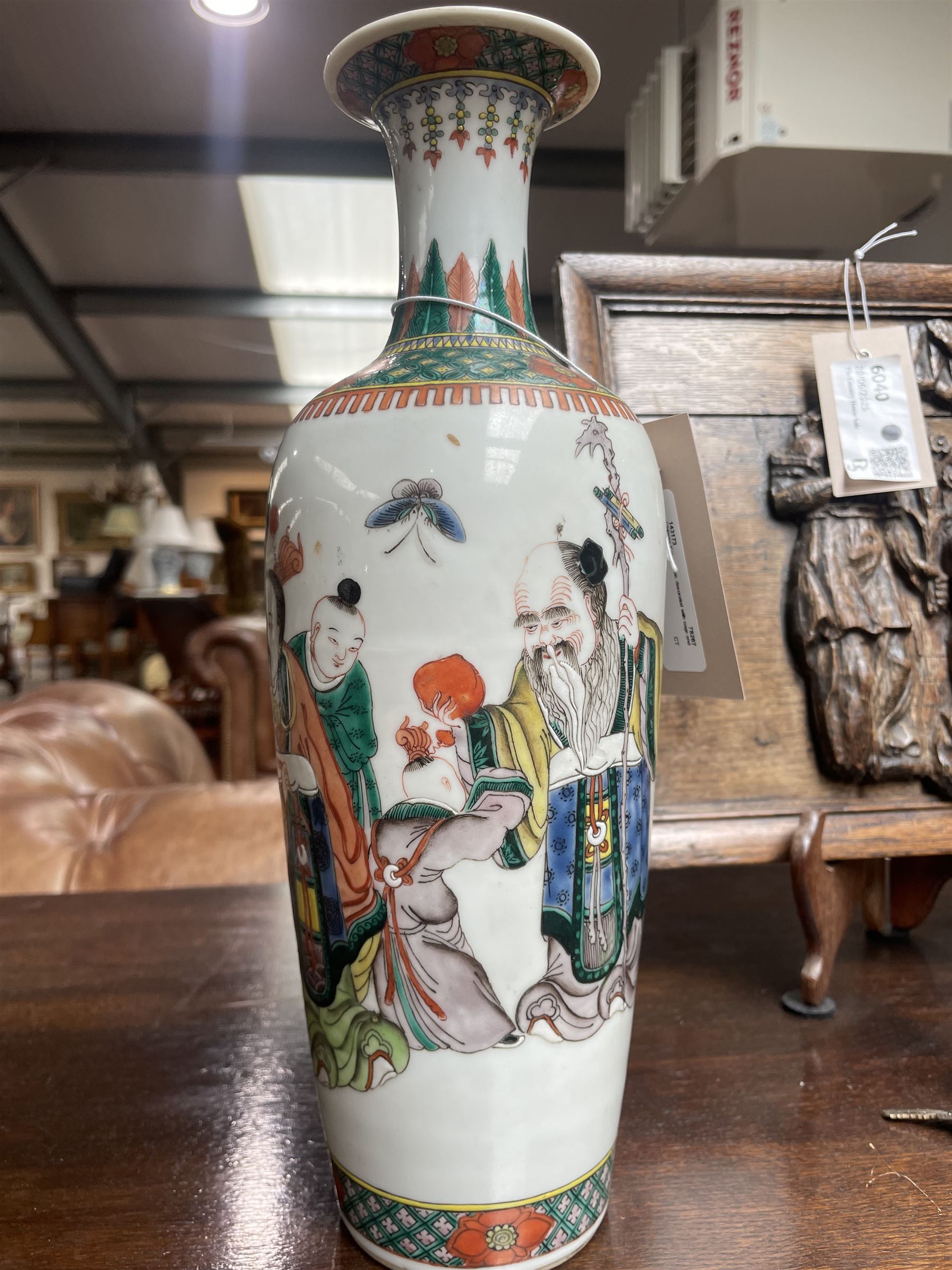 Chinese Kangxi famille verte vase of baluster form with fluted rim, decorated with sage and attendants within a trellis border, with four character Kangxi double ring mark beneath, H31cm 