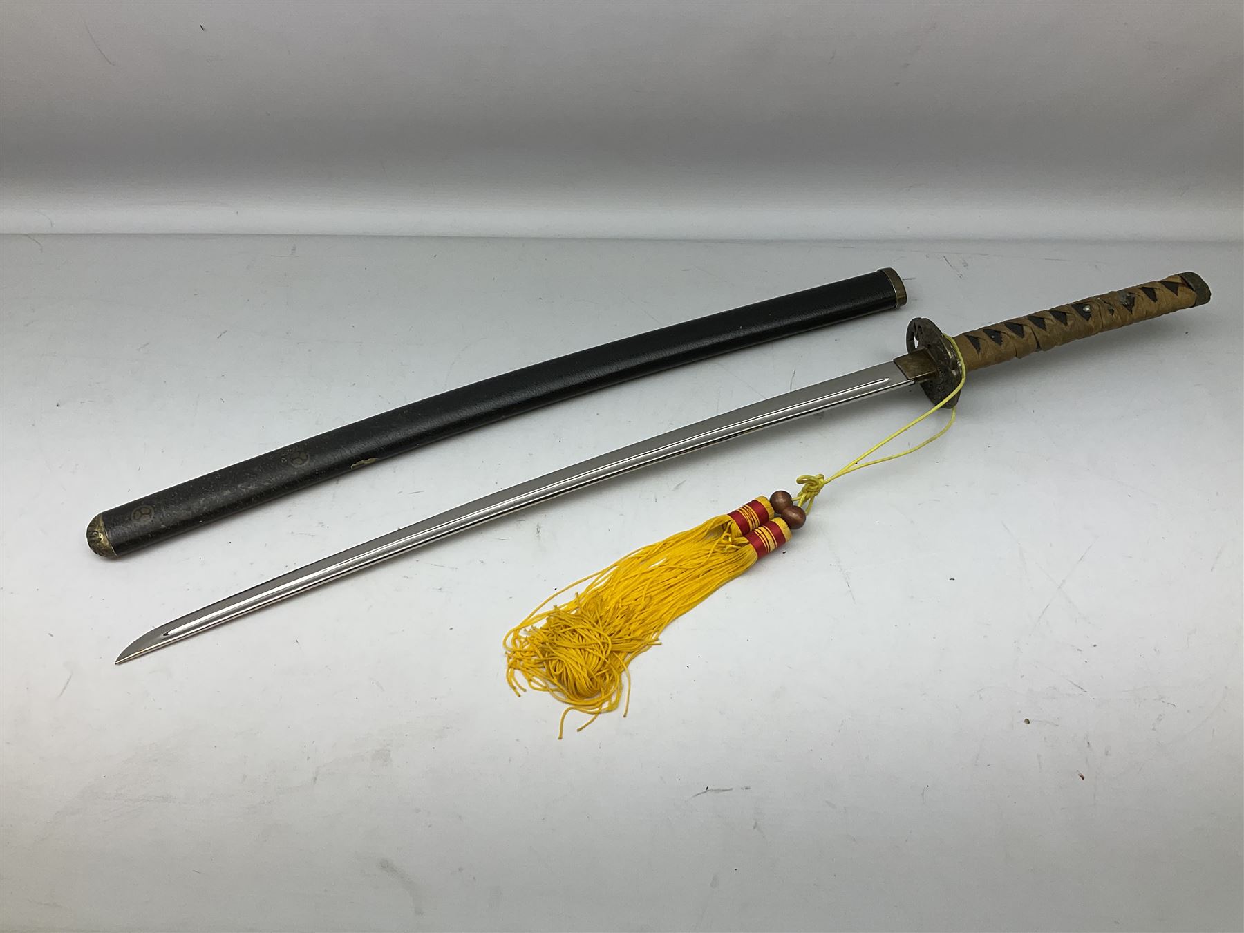 Three reproduction swords - Japanese katana and saya; Tai Chi sword with ornate scabbard; and dress sword with fullered triangular blade and horn handle (3)