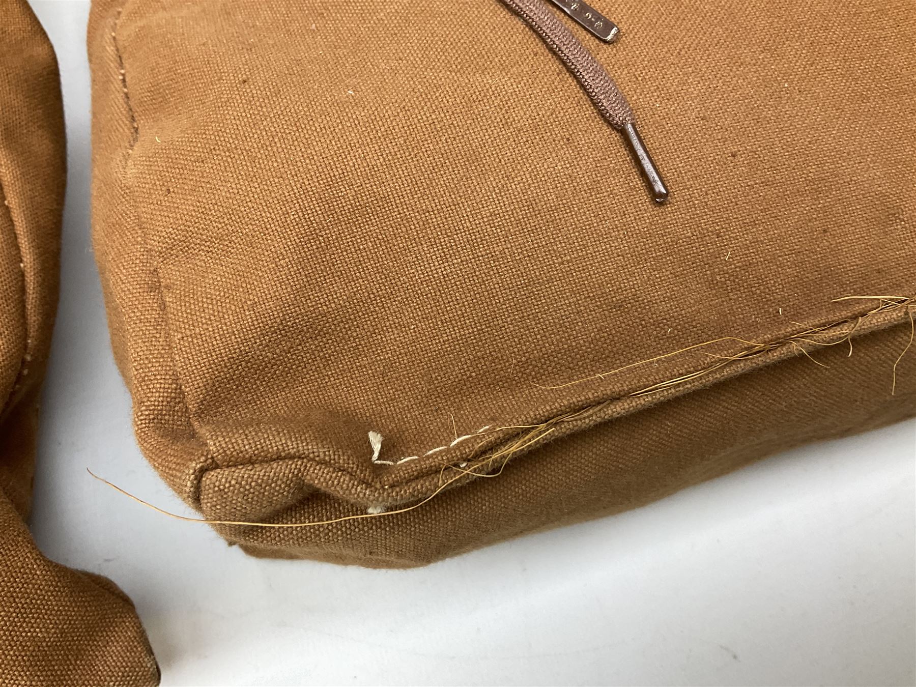 WW2 British Army RAMC 'Regimental Medical Pannier', well marked externally and dated 1941, stamped May 1943 internally, canvas covered wicker form with leather edges, hinged top and fall front with two rope carrying handles, fitted iron locking straps with securing chains; contains various unused field dressings and bandages with WW2 dates and two pillows; original label under lid L79cm