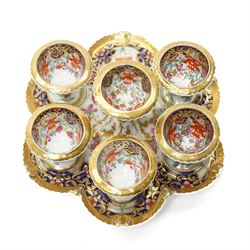 Early 19th century Chamberlain's Worcester egg stand of serpentine circular form fitted with five egg cups and decorated with flowers on a blue and gilt ground with gilt border and on paw feet D20cm. Printed mark used on the Regent body circa 1811-1820 
Provenance: property of a Nobleman