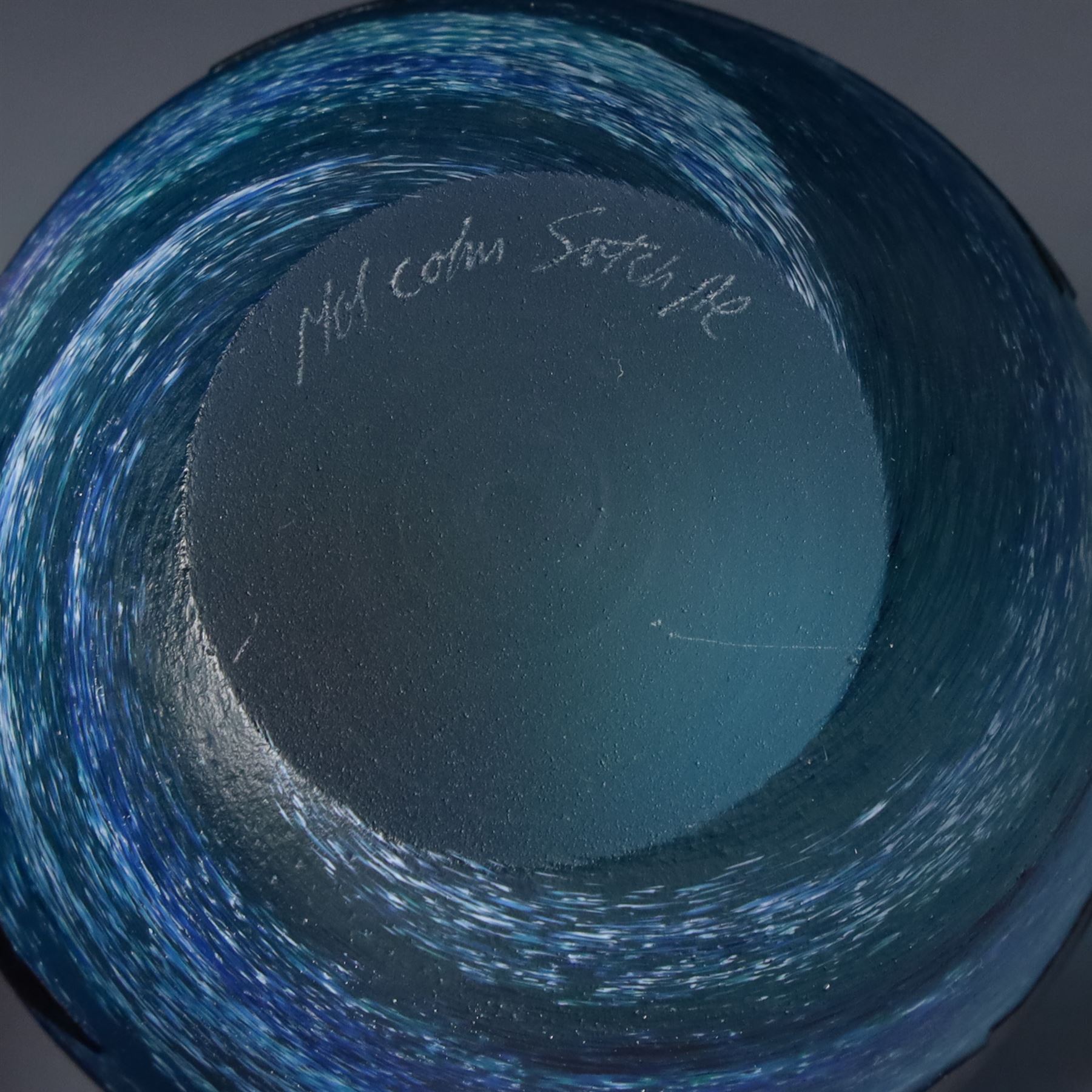 Malcolm Sutcliffe (British 1954-): Studio glass cameo bowl, the body mottled and speckled with shades of blue decorated with dolphins, etched signature, D18cm and matching paperweight (2)