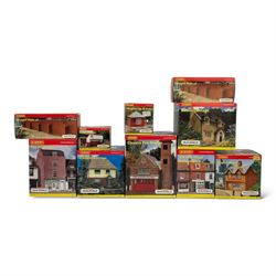 Ten Hornby '00' gauge Skaledale buildings, comprising two R8744 Straight Walls, R8564 Model Shop, R9768 The Pharmacy, R8501 Raven Cottage, R8515 Clovelly Cottage, R8626 Country Fire Station, R8588 Weighbridge & Scales, R8638 Platform & Shelter and R9763 Off Your Head Barbers Shop, all boxed