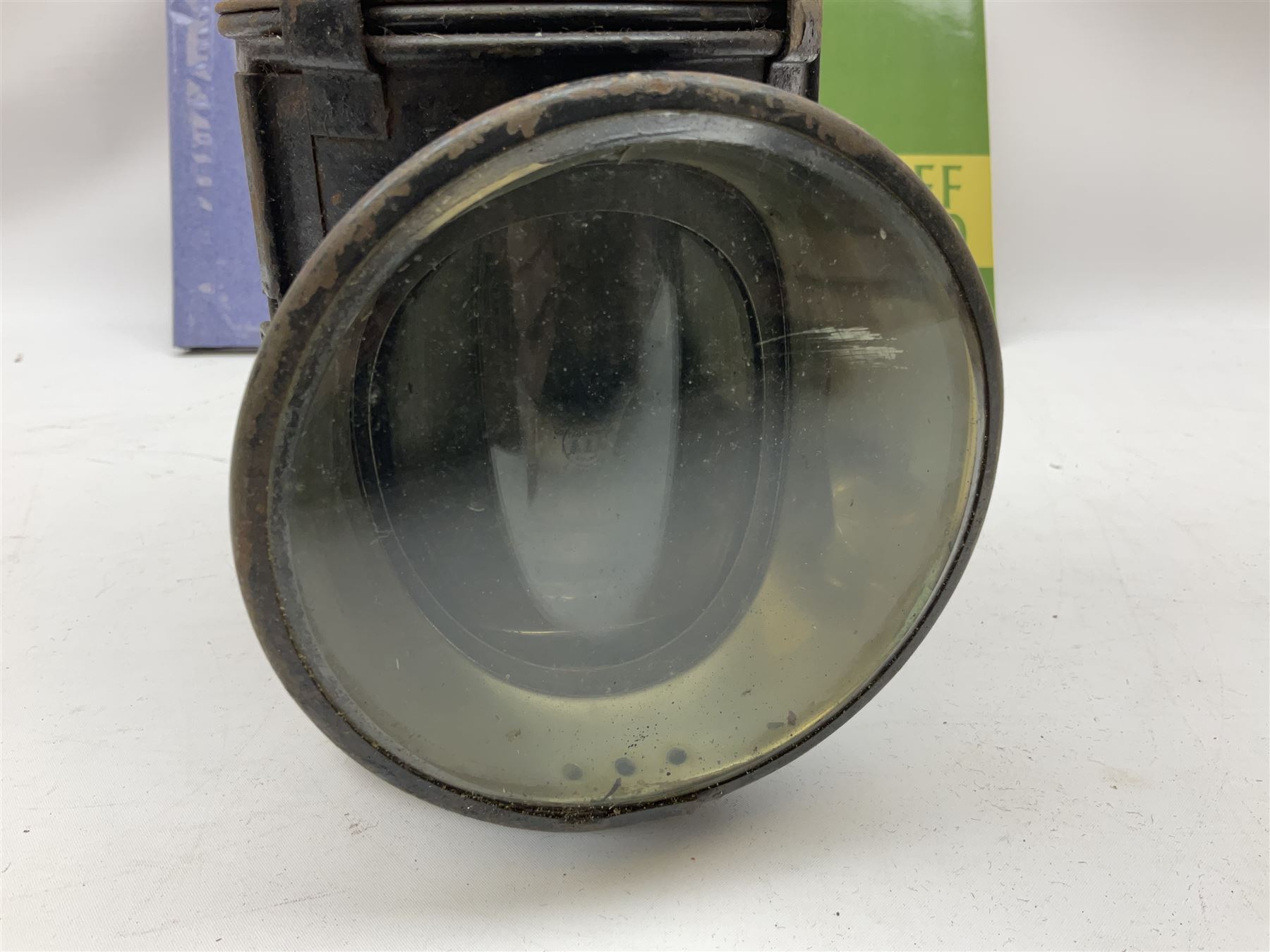 Black painted three colour railway lamp with revolving filters, H29cm; BR Acme Thunderer whistle; three railway peaked caps, two with BR Intercity 125 badge; small album of photographs of railway interest etc