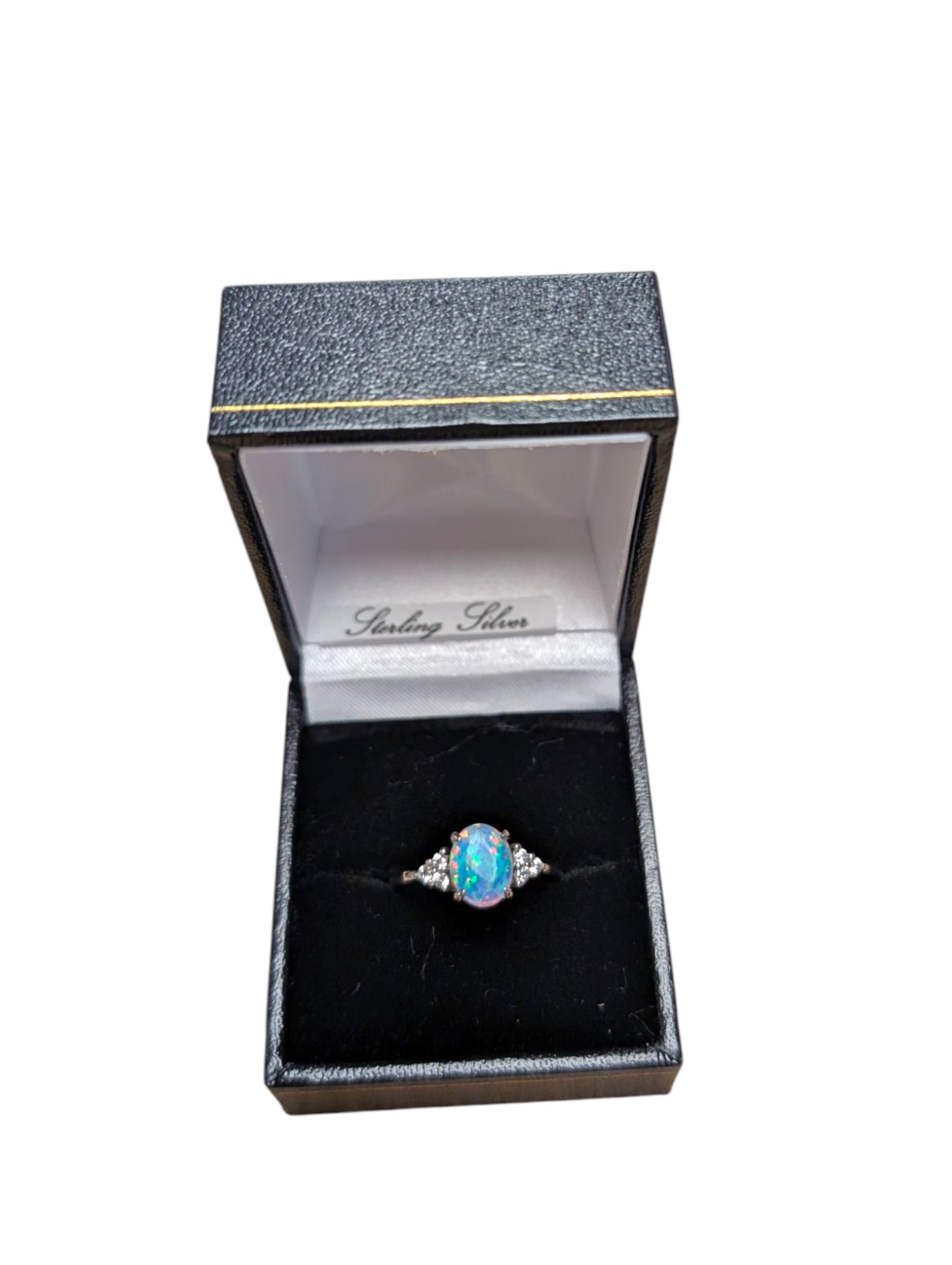 Silver opal and cubic zirconia cluster ring, stamped 925, boxed
