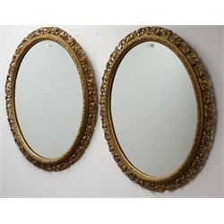  Pair oval gilt framed wall mirrors W67cm, H85cm  