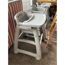 Set of three plastic and a pair of wooden baby high chairs with additional saddle stools (9)- LOT SUBJECT TO VAT ON THE HAMMER PRICE - To be collected by appointment from The Ambassador Hotel, 36-38 Esplanade, Scarborough YO11 2AY. ALL GOODS MUST BE REMOVED BY WEDNESDAY 15TH JUNE.