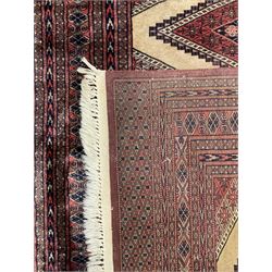 Persian rug, the interconnecting field decorated with four lozenge medallions, multiple band border with overall geometric design decorated with stylised flower head motifs