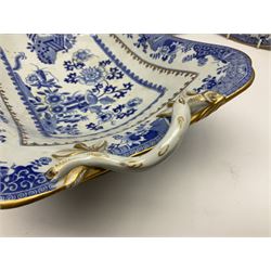 Early 19th century Spode dessert set, circa 1805-1830, blue and white transfer printed in the Grasshopper pattern, comprising comport of oblong form with twin naturalistically modelled branch handles, two oval dishes, and six plates, each with blue or green printed mark beneath, including handles comport H11.5cm W34cm, oval dishes W26.5cm, plates D20.5cm