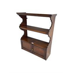 Edwardian walnut wall cabinet, shaped end supports, fitted with two shelves and double cupboard