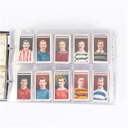 Collection of Edwardian and later Football related trading and cigarette cards, including forty-nine of fifty 1906 Ogden's Football Club Colours, 1922 PALS Footall series, ninety of one hundred 1925 Gallaher Famous Footballers, complete set of forty-four 1926 Ogden's Captains of Association Football Clubs and Colours, complete set of fifty 1927 Players Football Caricatures by MAC,  complete set of fifty 1927 Players Football Caricatures by RIP,  complete set of fifty 1930 Players Association Cup Winners, complete set of 50 1933 Ogdens AFC Nicknames etc, housed in brown cigarette card album