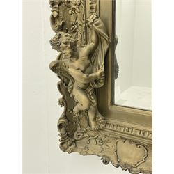 Victorian style gilt framed mirror, the pediment set with putto holding torch adorned with floral garland, swept frame decorated with scrolling foliage and shaped cartouche motifs, the rectangular bevelled plate flanked by two winged putto figures holding linen swags