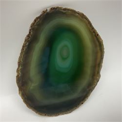 Pair of green agate slices, polished with rough edges raised upon silvered metal stands, H19cm