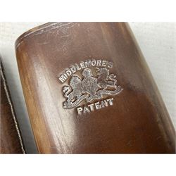 Victorian leather cigar protector with metal match striking plate on the end and internal spring to hold the cigars in place; expands for differing lengths of cigar, minimum L12.5cm; another similar leather cigar case marked Middlemore's Patent with attached vesta case and striker; three Bryant & Mays tin-late matchbox holders including 1935 Jubilee; and small box of matches (6)