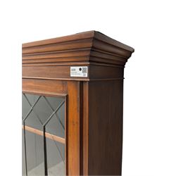 Early 20th century walnut display cabinet, projecting moulded cornice over two lead glazed doors, the interior fitted with three adjustable shelves, on cabriole supports