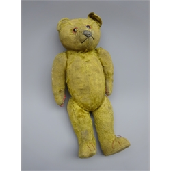  Early 20th century teddy bear with straw filled body, applied eyes, stitched features and jointed limbs H38cm  
