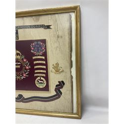 Commemorative Military needlework, headed 'VII Princess Royal's Dragoons Guard, the central flag has the regimental title, surrounded by a Union wreath of roses, thistles and shamrocks, topped with a crown, the Hanoverian white horse features in two corners, framed H58cm, L73cm