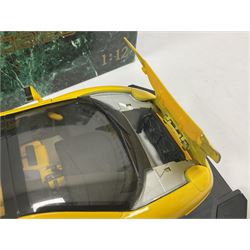 Two Maisto 1:12 scale Jaguar XJ220 ‘Racing’ cars in yellow, both on plinths in original boxes 