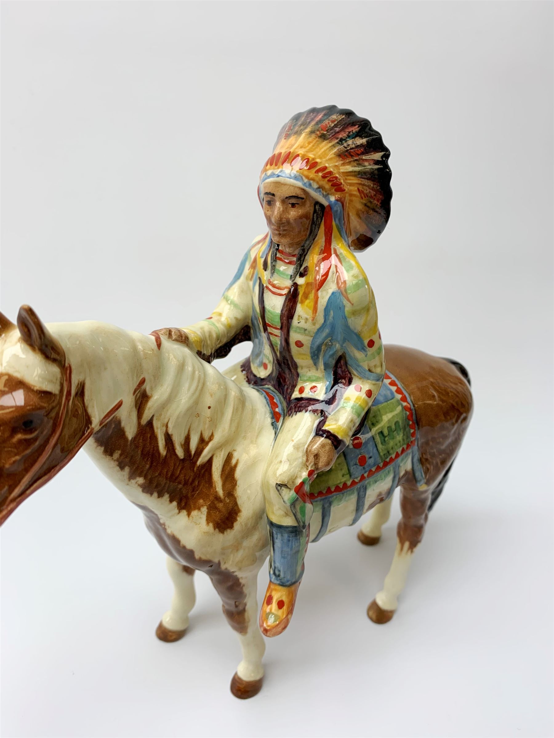 A Beswick Native American on horseback, with printed mark beneath, H21.5cm. 