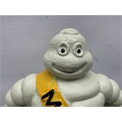 Cast iron figure of Michelin Man, stood on a tyre, H34cm 