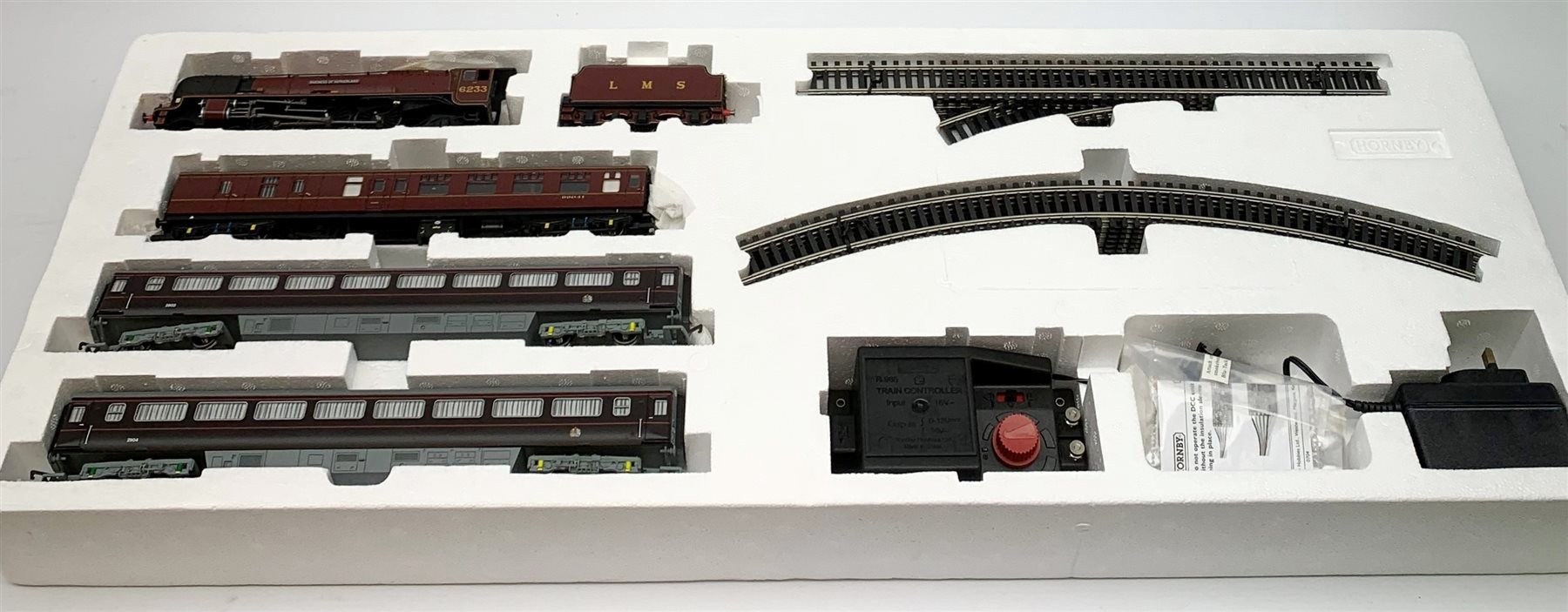 Hornby '00' gauge - limited edition Marks & Spencer The Royal Train QEII 80th Birthday Commemorative set with Princess Coronation Class 4-6-2 locomotive 'Duchess of Sutherland' No.6233 with three coaches, No.1134/1500, boxed with certificate, Trakmat and Leaflet Pack