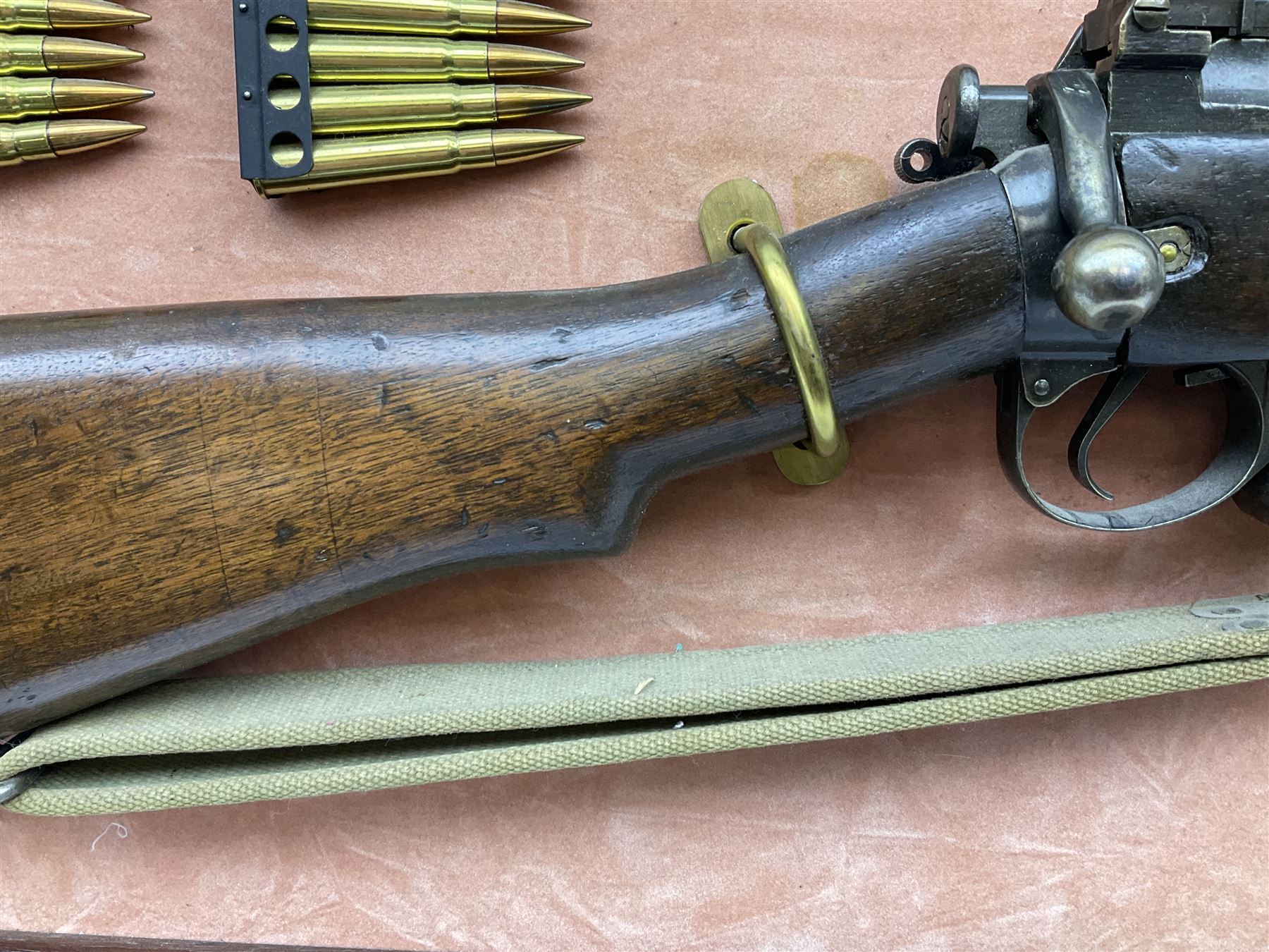 WW2 Lee Enfield No.4 Mk.1 .303 bolt-action rifle with hinged butt compartment, made by SA Ltd., Long Branch, Canada 1942, serial no.5L0646 L113cm; mounted on a framed display board with No.4 Mk.II spike bayonet, No.9 Mk.1 blade bayonet, two inert 5-round clips and brass biographical plaque by Antler Military Originals detailing DA Cert No.C3444 OLD STYLE DEACTIVATION SO FIREARMS CERTIFICATE REQUIRED OR RFD