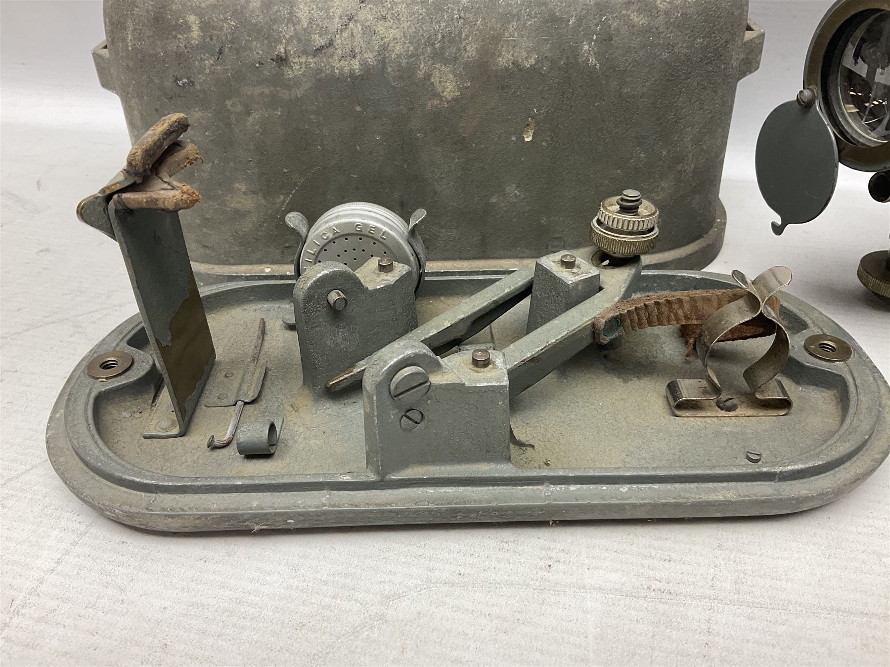 Cooke Troughton & Simms grey painted brass dumpy level in carrying case; and WW2 British .303 Vickers Machine Gun brass Clinometer, stamped 'V.E. 0067' serial No. 2370,  dated 1944 unboxed (2)