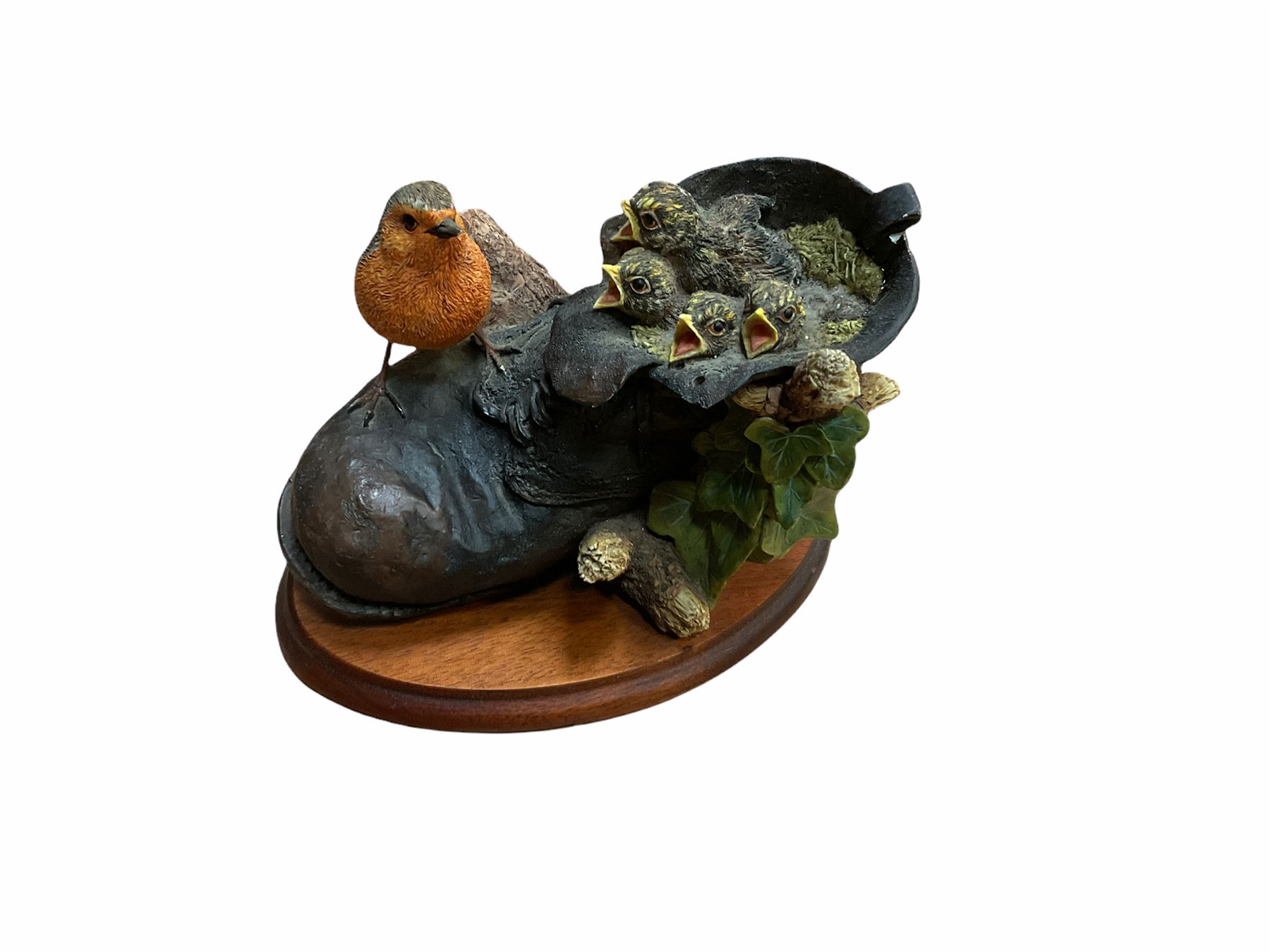 Border fine arts figures, Pick of the litter, model no JH30, by Ray Ayres L26cm, Tug of war, model no JH61, by D Walton H11.5cm and Robin with chicks in boot, model no RB45, by by Ray Ayres H11cm.  