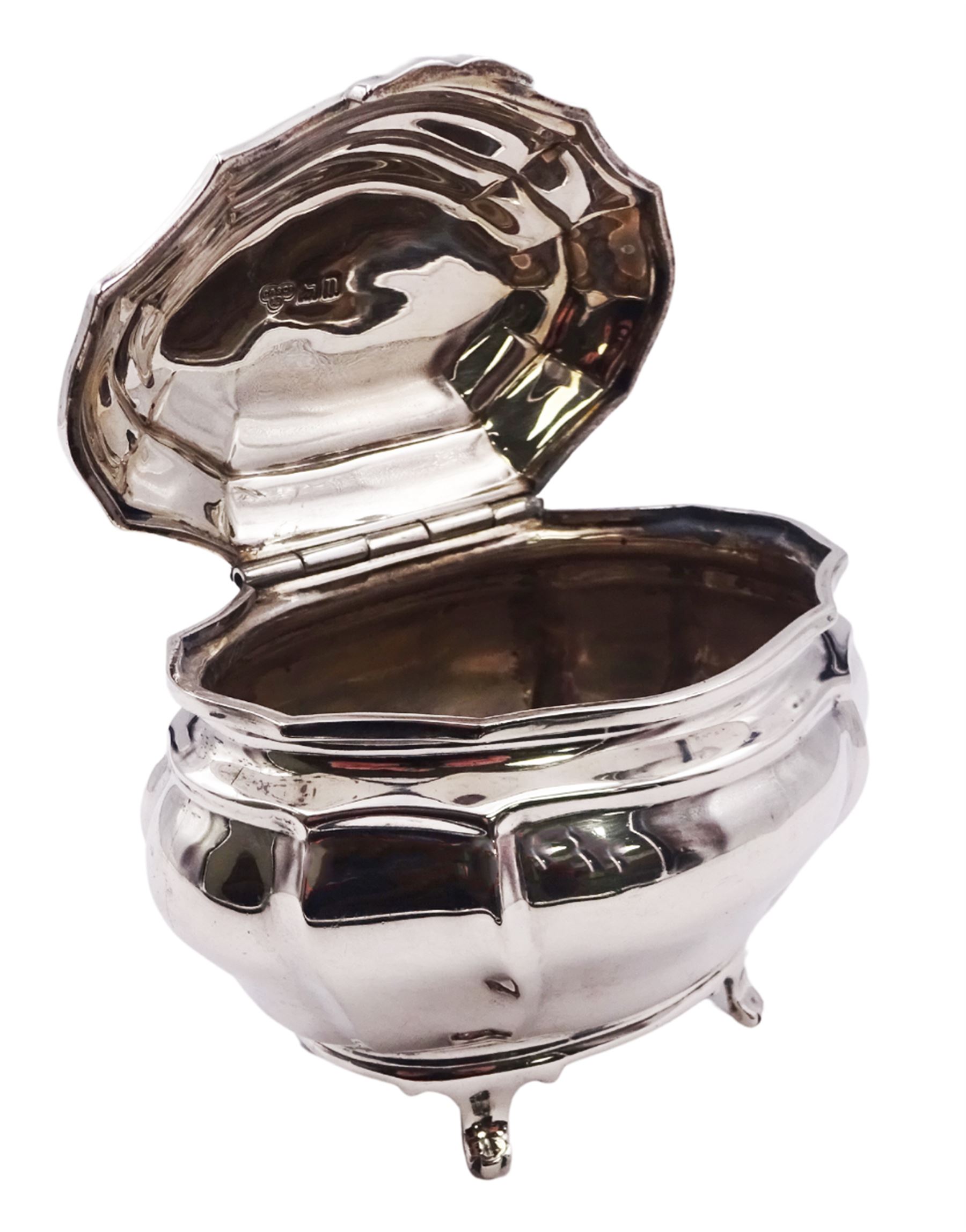 Edwardian silver tea caddy of bombe form, the hinged cover engraved with lion crest, upon four paw feet, hallmarked Goldsmiths & Silversmiths Co Ltd, London 1908, H8.5cm W10cm, approximate weight 5.25 ozt (163.2 grams)