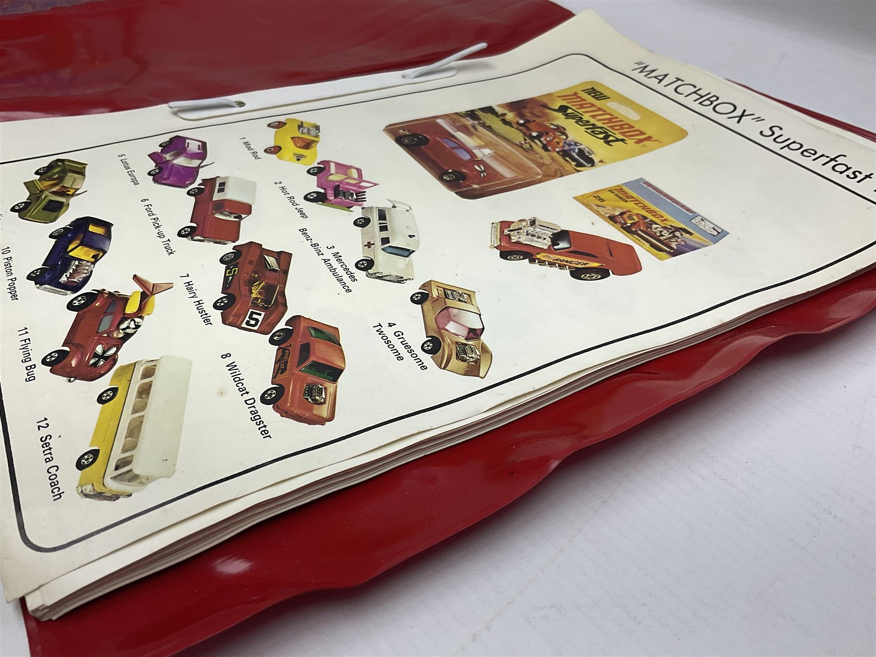Matchbox 1-75 Series 'Superfast' ex-shop stock - eight models comprising two 62d Dragster, two 64c Slingshot Dragster, two 65d Saab Sonnet III and two 75c Alfa Carabo; all boxed; together with Matchbox trade catalogue c1973 in original vinyl cover (9)