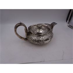 George III Irish silver teapot, of squat circular form, the body with repousse and chased floral and C scroll decoration, with capped C handle and ivory insulators, engraved to base 'Presented to Troop Sergeant Major John Percival, of the 4th Dragoon Guards by Alex D. Tait, Esq, late Captain in that corps as a mark of approbation of his steady and upright conduct when Sergeant Major of his Troop, Dublin, June 2nd 1843', hallmarked William Law, Dublin 1817, H12.5cm, This item has been registered for sale under Section 10 of the APHA Ivory Act