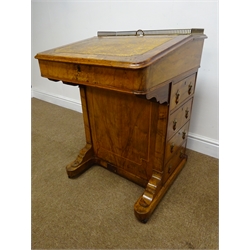 Small Victorian inlaid walnut Davenport desk, raised brass gallery back, hinged pen compartment, sloping leather inset top, four drawers, solid end supports on castors, W54cm, H75cm, D52cm  