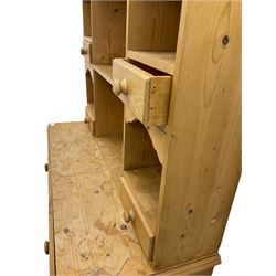 Solid pine dresser, raised plate rack fitted with small drawers over two drawers and double cupboard, plinth base