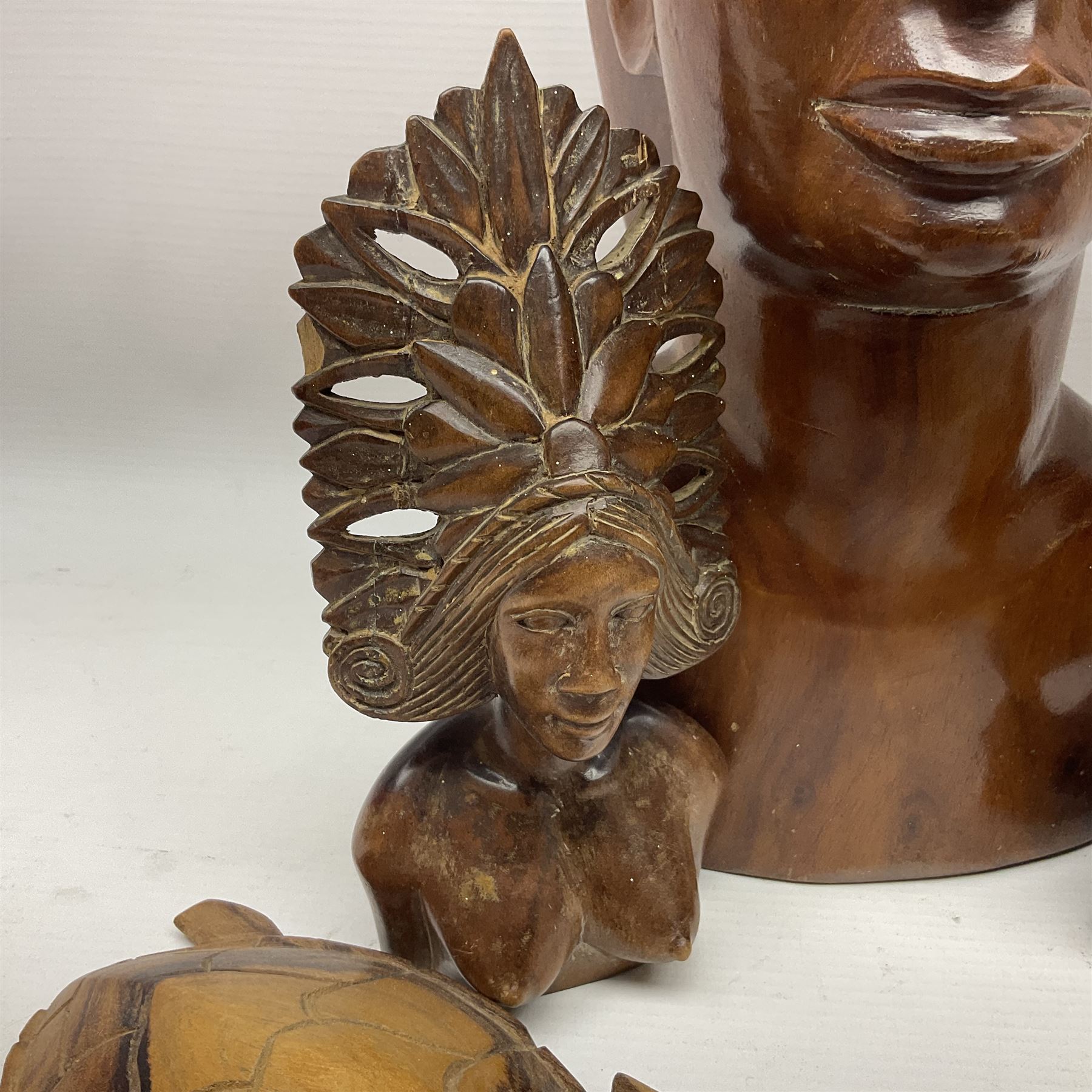 20th century wooden carvings from the Solomon Islands, including female bust in headdress, turtle etc  