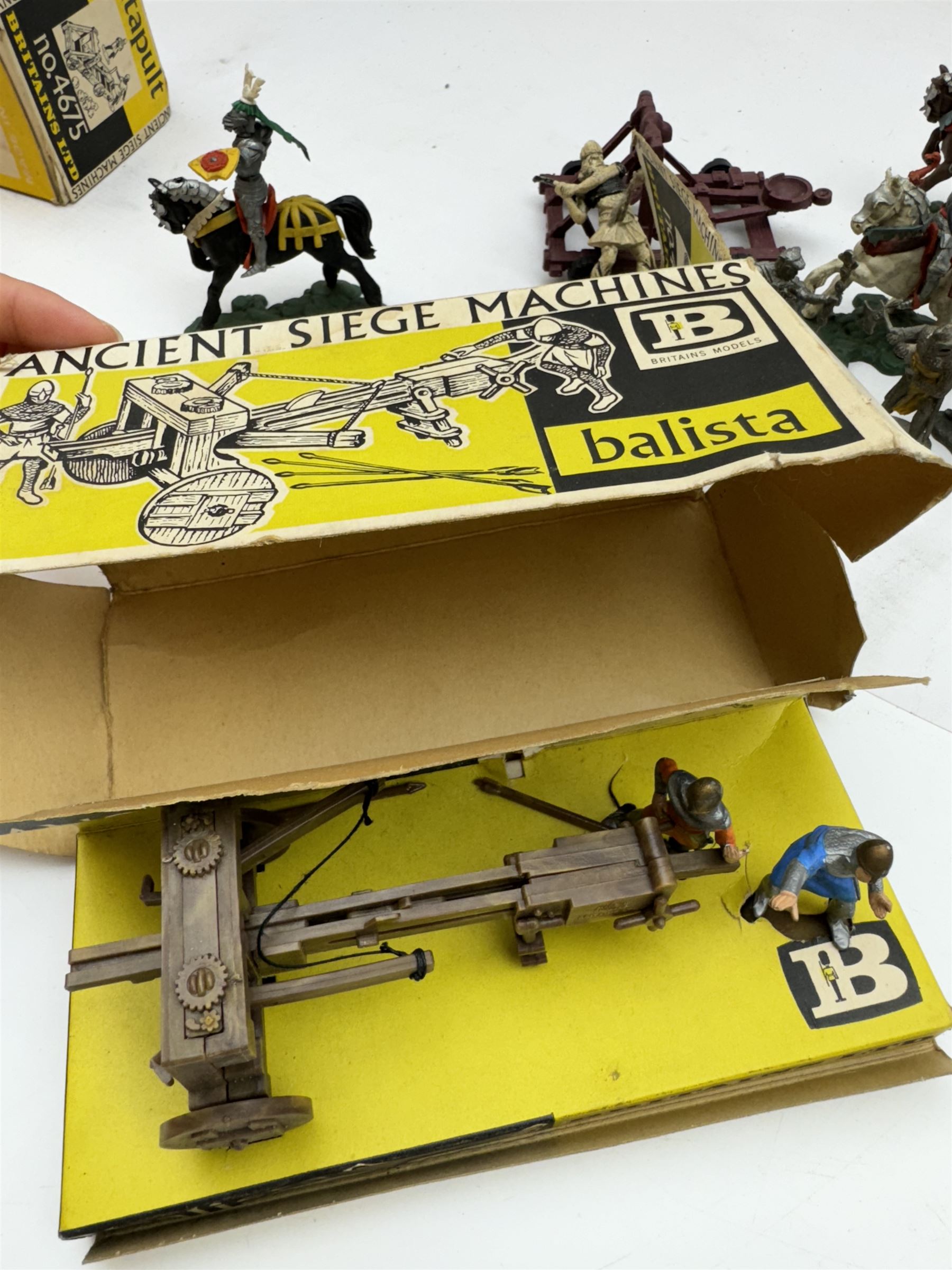 Two Britain's Ancient Siege Machines, comprising Balista and Catapult and a collection of plastic knights and soldiers, including Britains examples etc
