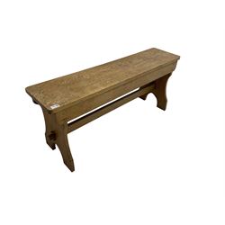 20th century light oak trestle bench, plank top on shaped end supports joined by pegged stretcher