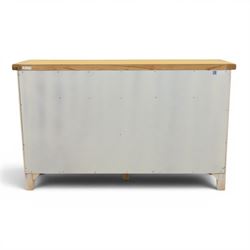 Contemporary white painted sideboard, oak veneered top above three drawers with metal cup handles, two central rattan drawers flanked by cupboards