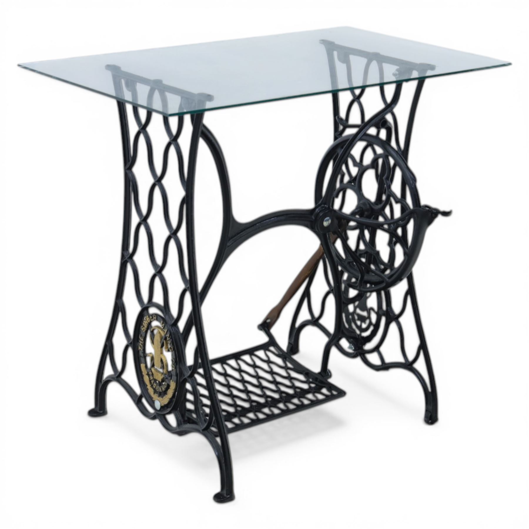 Sewing machine table with glass top, with Singer wrought metal base and foot pedal