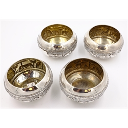  Set of four Indian silver bowls embossed pastoral and hunting scenes stamped A.Bhicajee & Co Bombay silver, 13cm diameter approx 16oz  