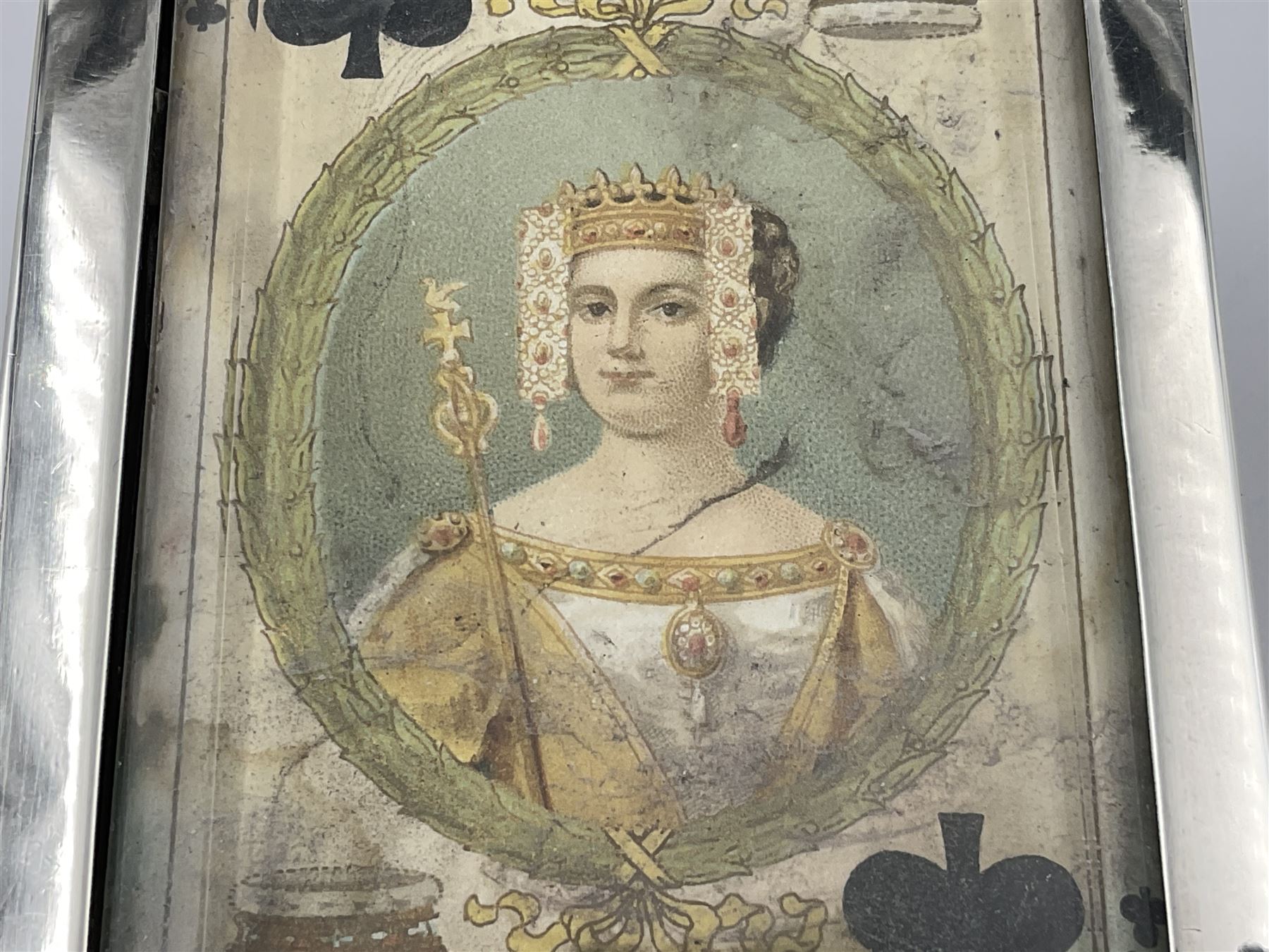 Edwardian silver mounted playing card case, hallmarked William Harrison Walter, Birmingham 1903, the sides each with a period playing card set behind a bevelled glass panel, the hinged cover with later engraving 'Presented to Norman T Crombie Esq by the officers & men of the 31st WR Detachment for services rendered 1917-1918', with red leather lined interior, the three compartments upon a sprung base and containing two later wooden Whist markers, case H12.5cm