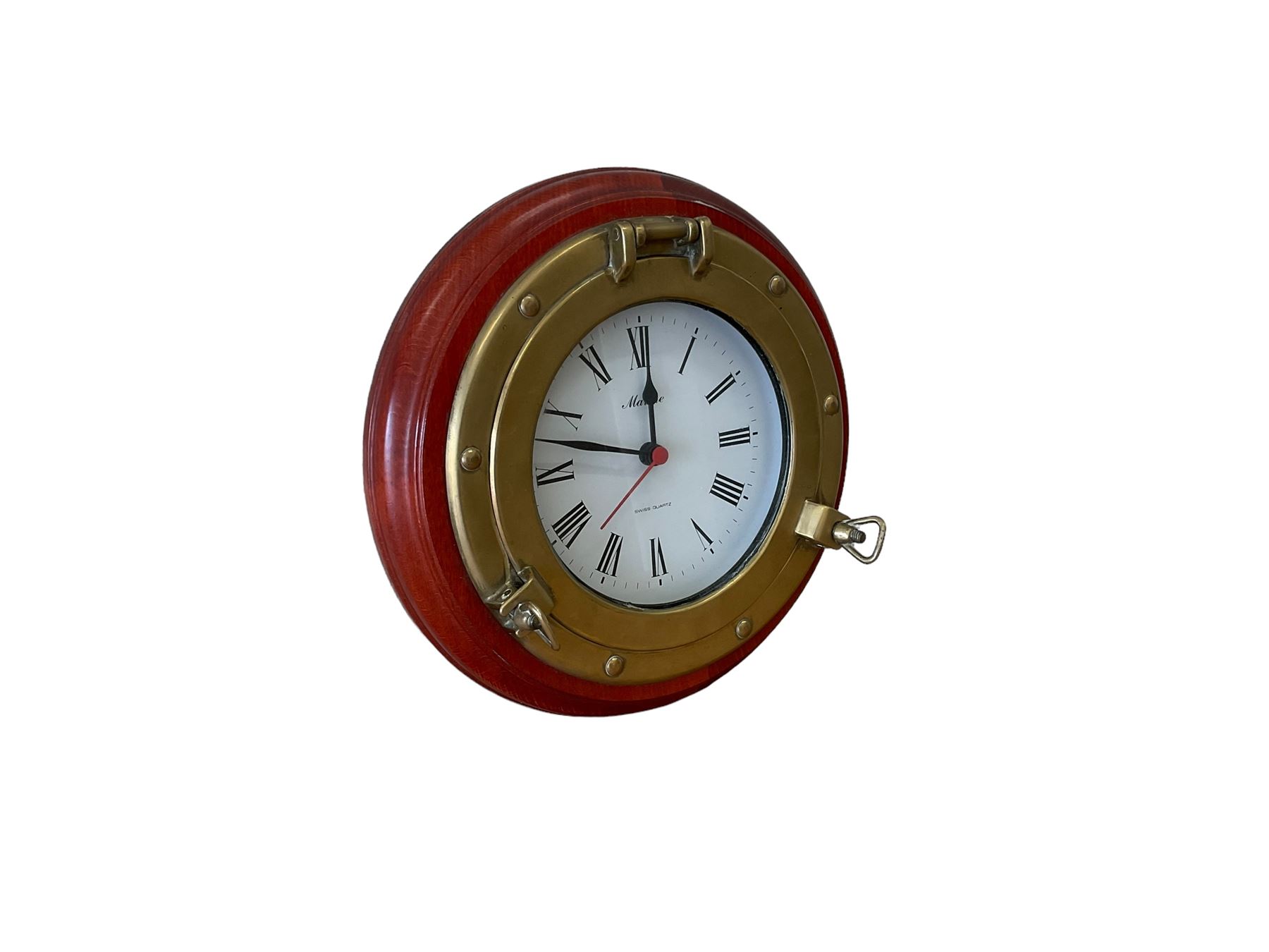 20th century marine clock with a mahogany surround and cast brass “porthole” bezel, with a 6” dial and Swiss battery operated quartz movement.