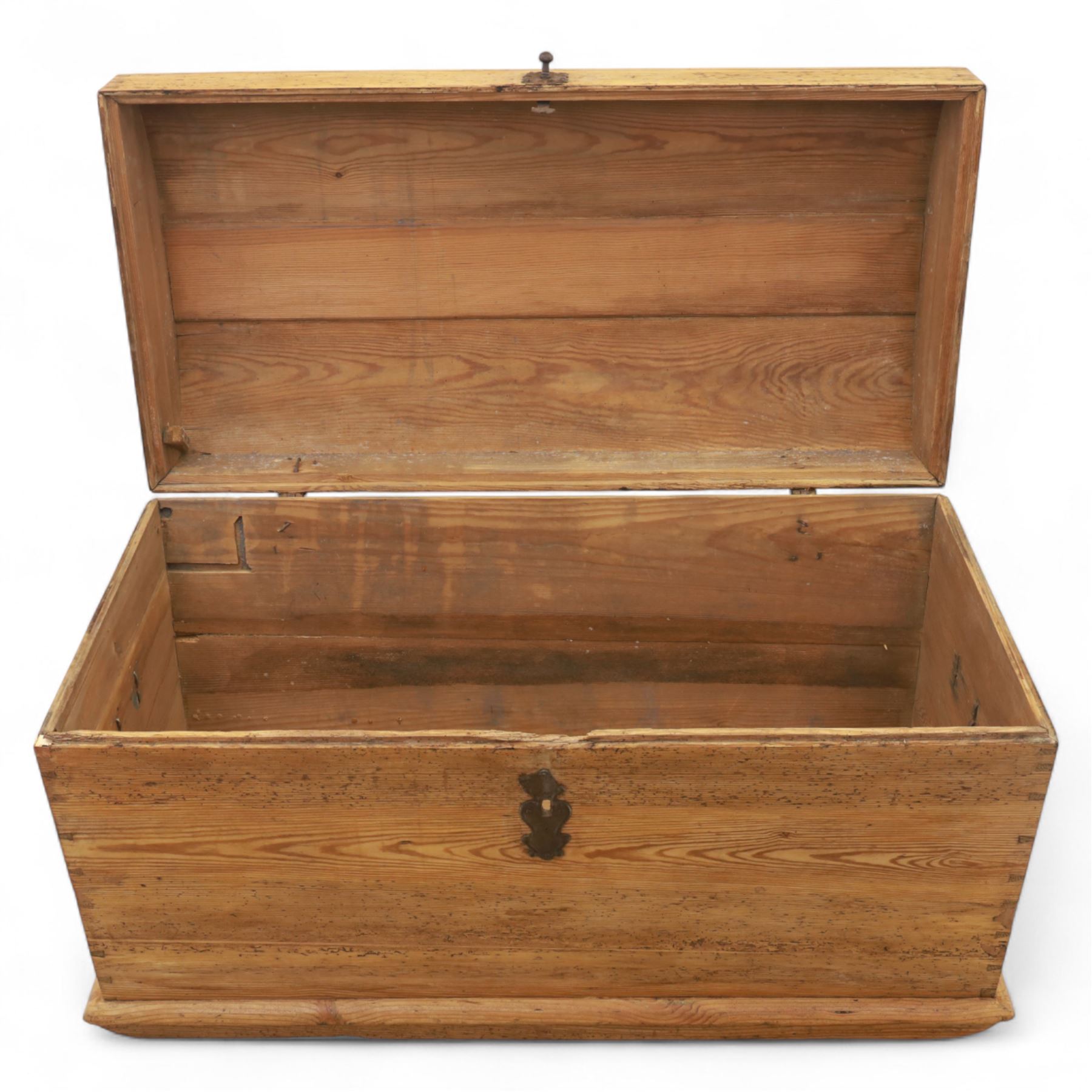 Early 20th century pine coffer, domed lid over plain front and sides with exposed dovetail joints, iron hasp and staple to front