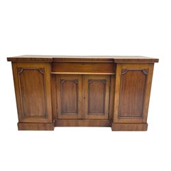 Late Victorian mahogany breakfront sideboard, central frieze drawer over two panelled doors enclosing single shelf, flanked by two single cupboard doors, enclosing shelves and cellarette drawer
