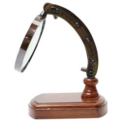 Magnifying glass on wooden stand