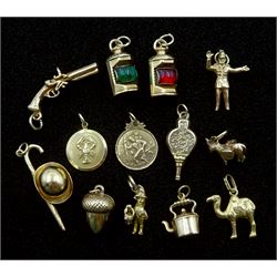 Twelve 9ct gold charms including acorn, gun, lantern, hat and umbrella and kettle and an 18ct gold camel charm, all hallmarked or tested (13)